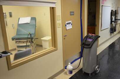 Picture of using HaloFogger to disinfect a room in the hospital.